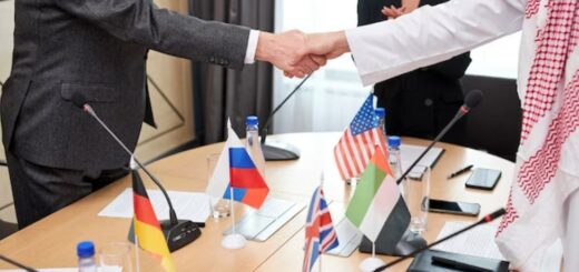 Two intercultural delegates shaking hands after a successful meeting