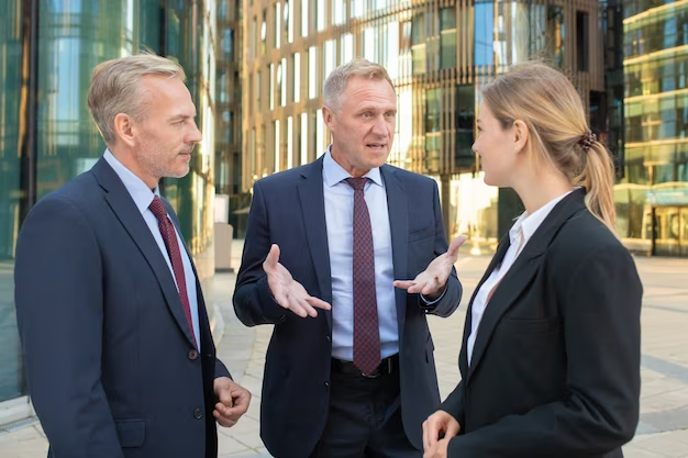 Business team discussing a project outdoors