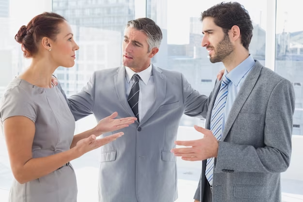 A group of people discussing something in the office